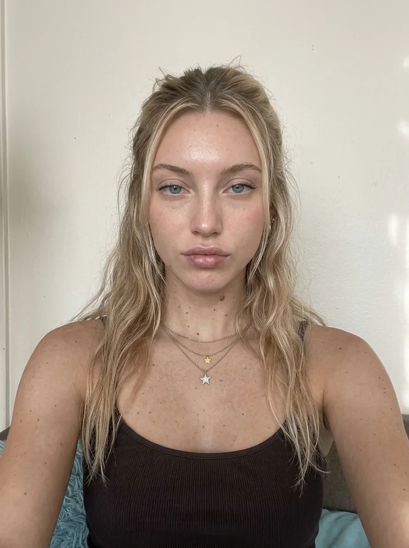 Avatar two facing camera, hair down, bare skin in soft daylight